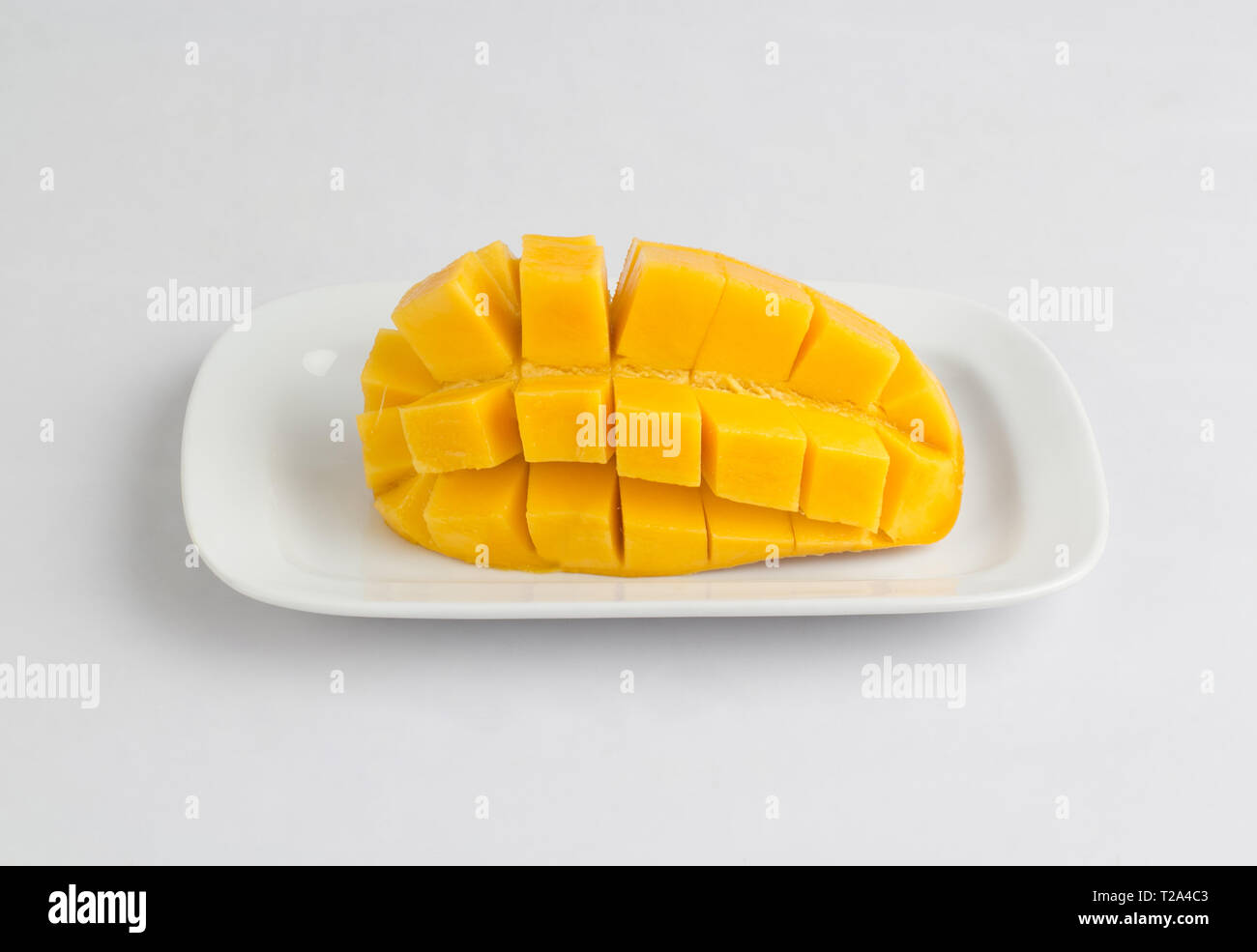 Fresh mango sliced diced isolated on white background Stock Photo