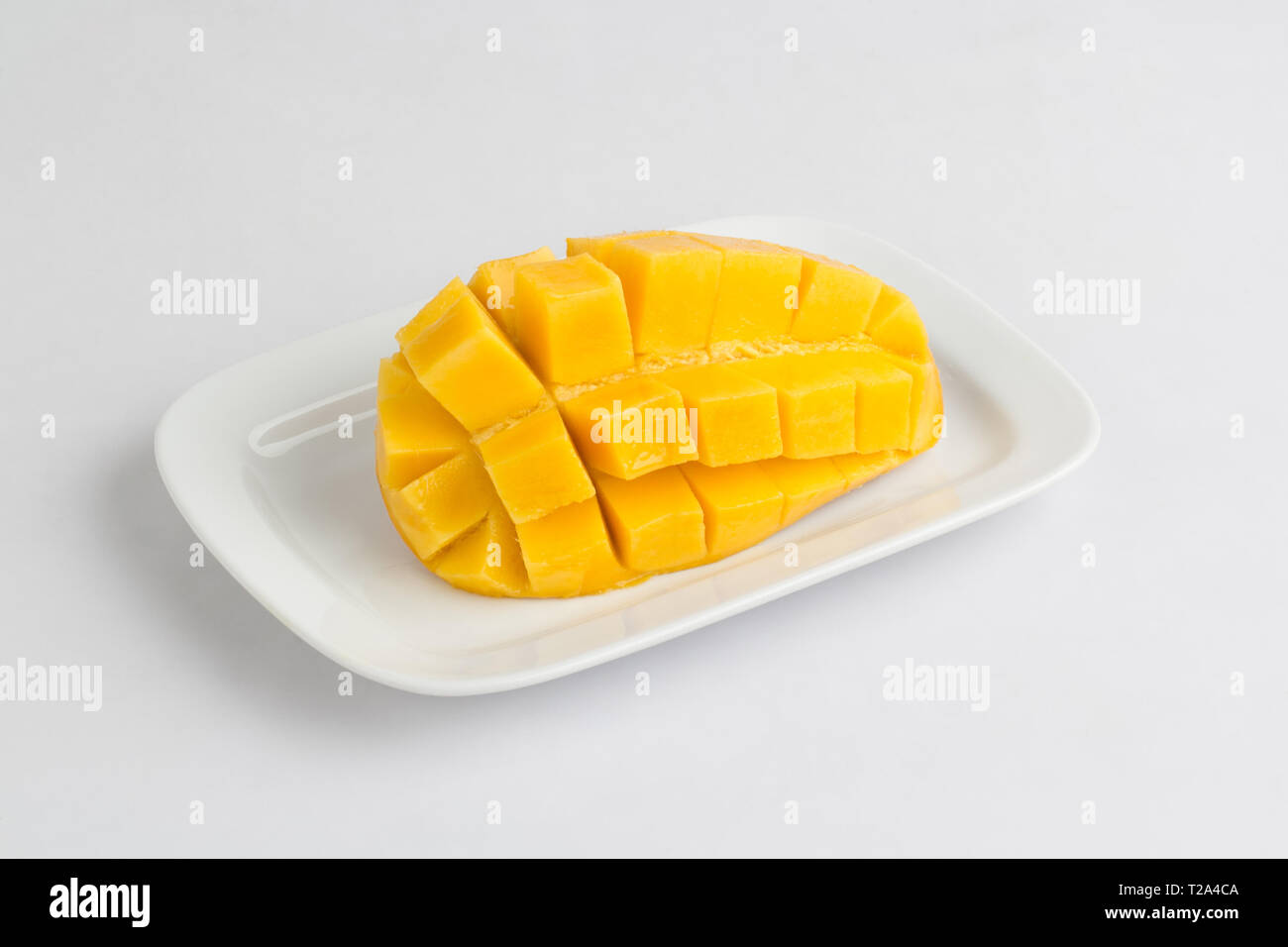 Fresh mango sliced diced isolated on white background Stock Photo