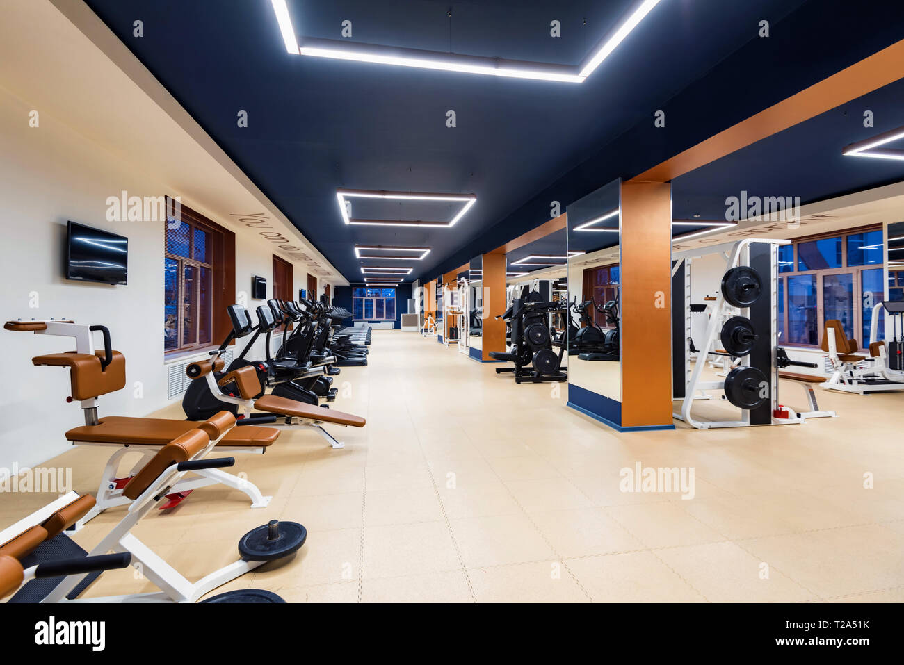 New fitness machines in modern gym interior Stock Photo