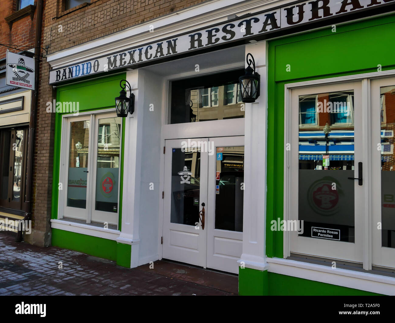 NORWALK, CT, USA - MARCH 26, 2019:  Bandido Mexican restaurant sign and entrance on Washington St. near railroad bridge. Stock Photo