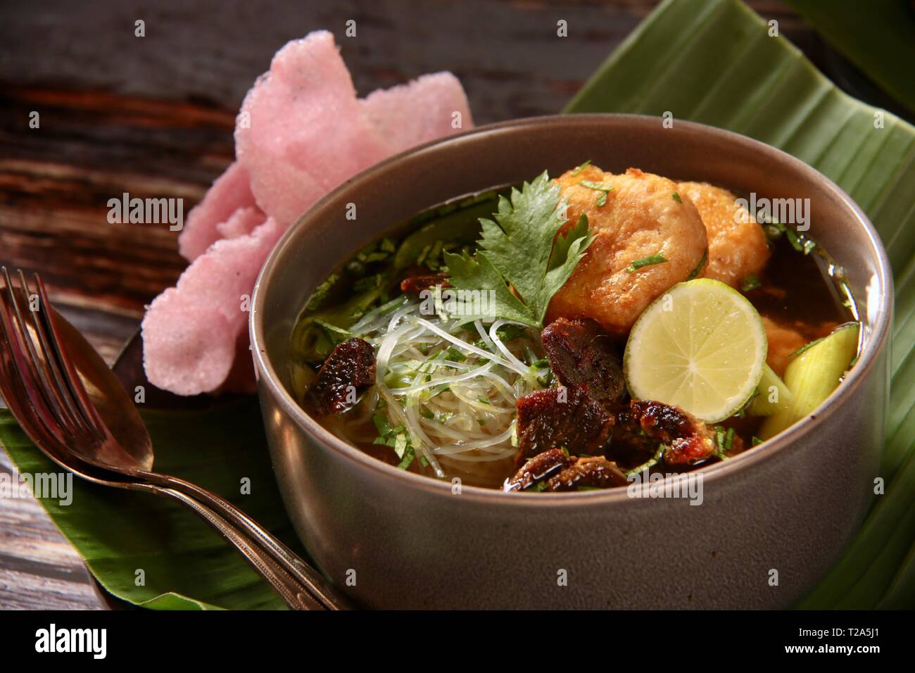 Soto Padang. Traditional beef jerky soup from Padang, West Sumatra Stock Photo
