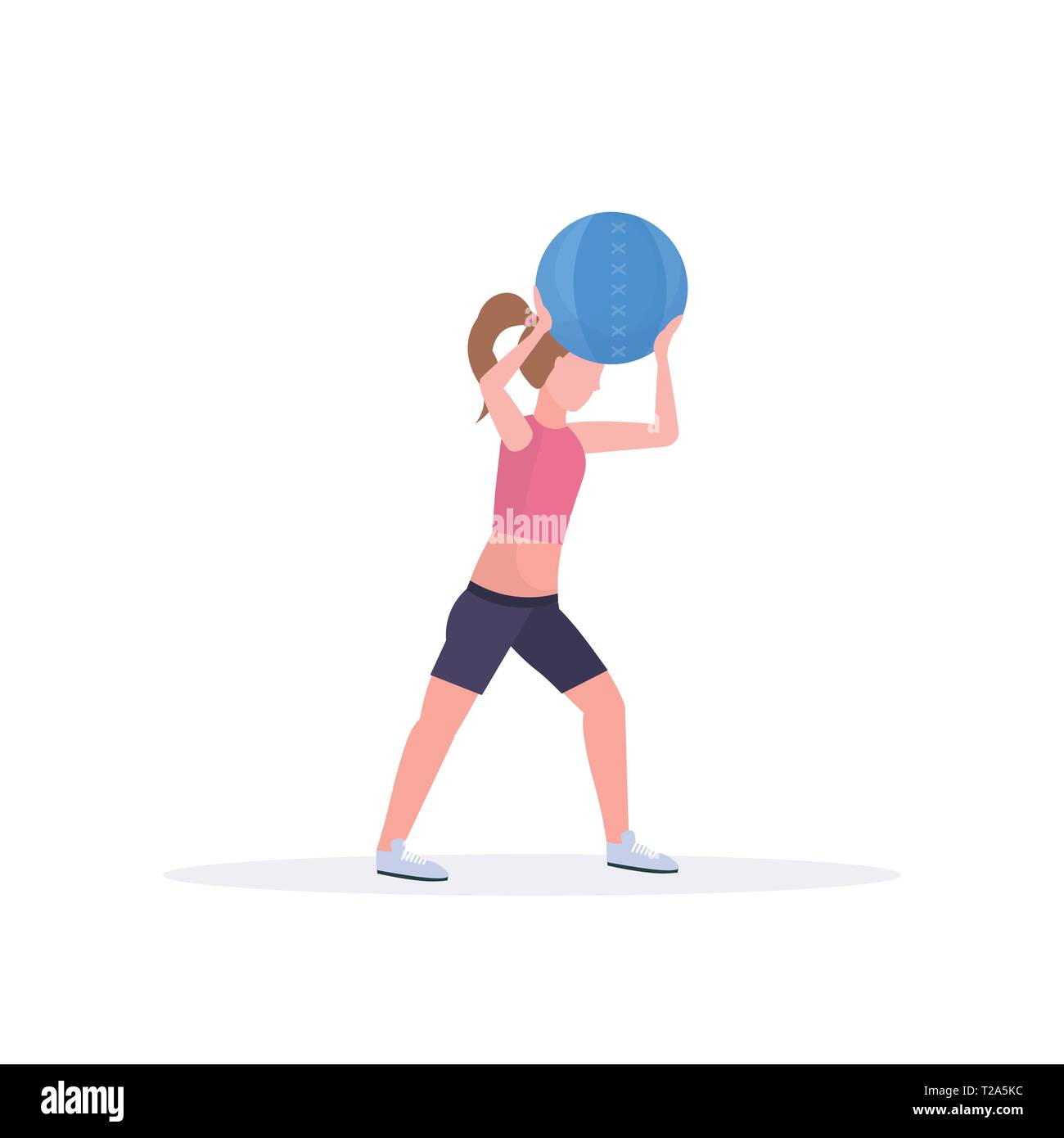sporty woman doing crossfit exercises with medicine leather ball girl