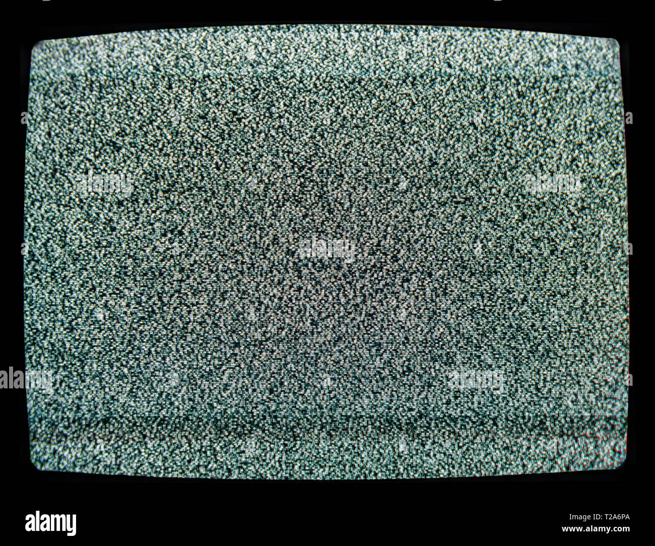 Static noise on CRT screen of de-tuned vintage TV set - lost signal background Stock Photo