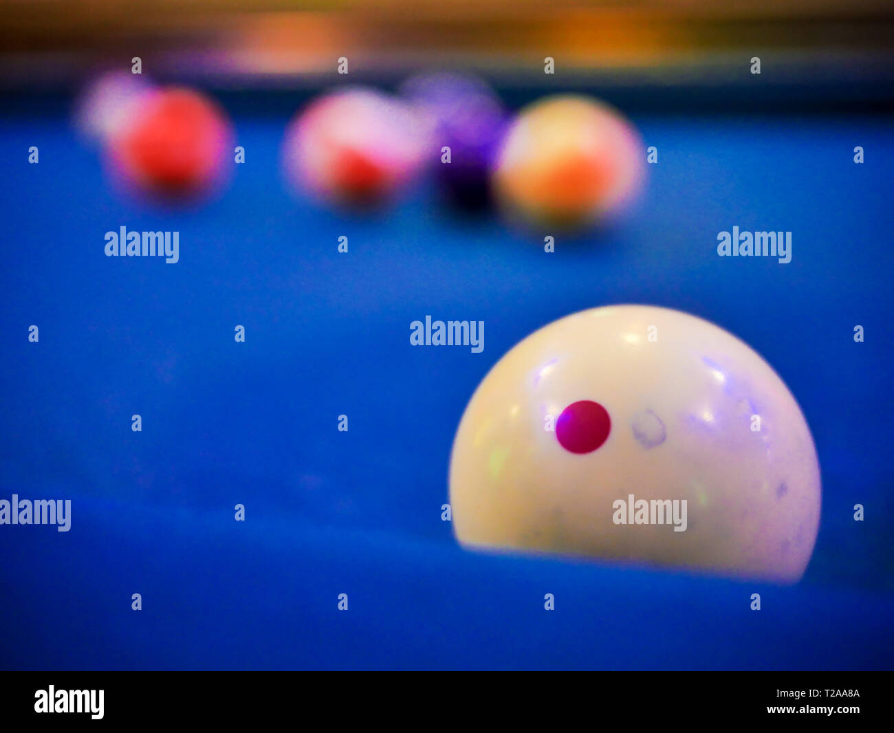 Billiard snooker white ball number close up on pool blue table Stock