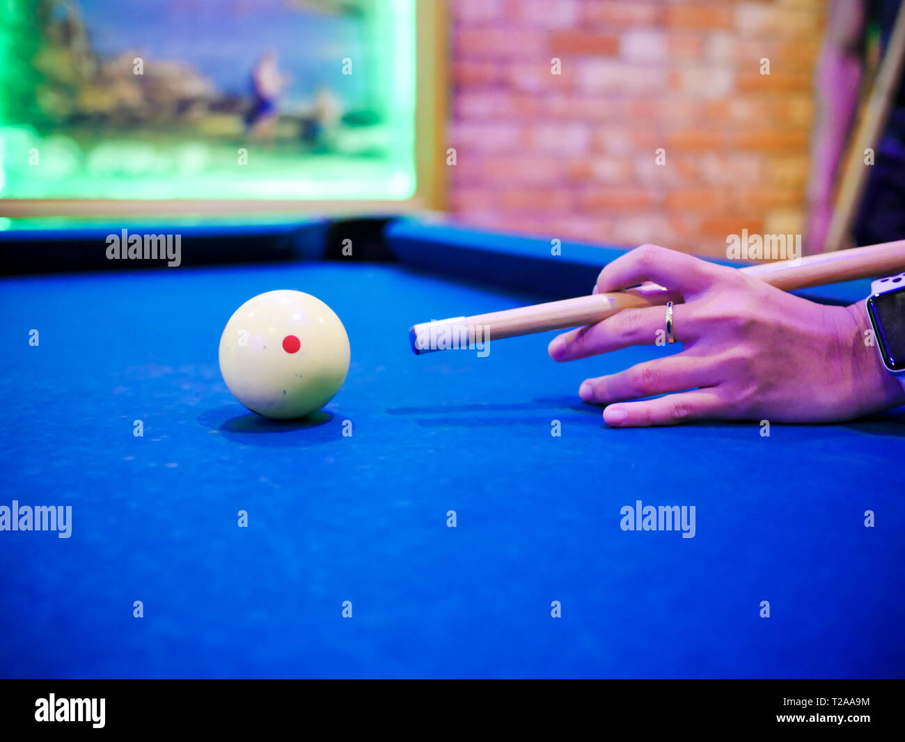 Hands aiming white ball to shot close up Stock Photo