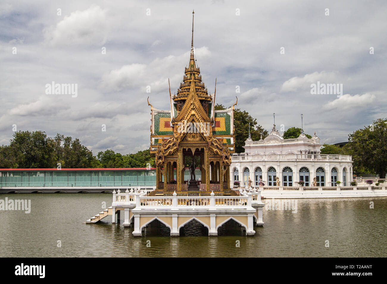 Saovarod Bridge, Floating Pavilion and Tevaraj-Kanlai Gate at Bang Pa-In Palace, Ayutthaya, Thailand. Stock Photo