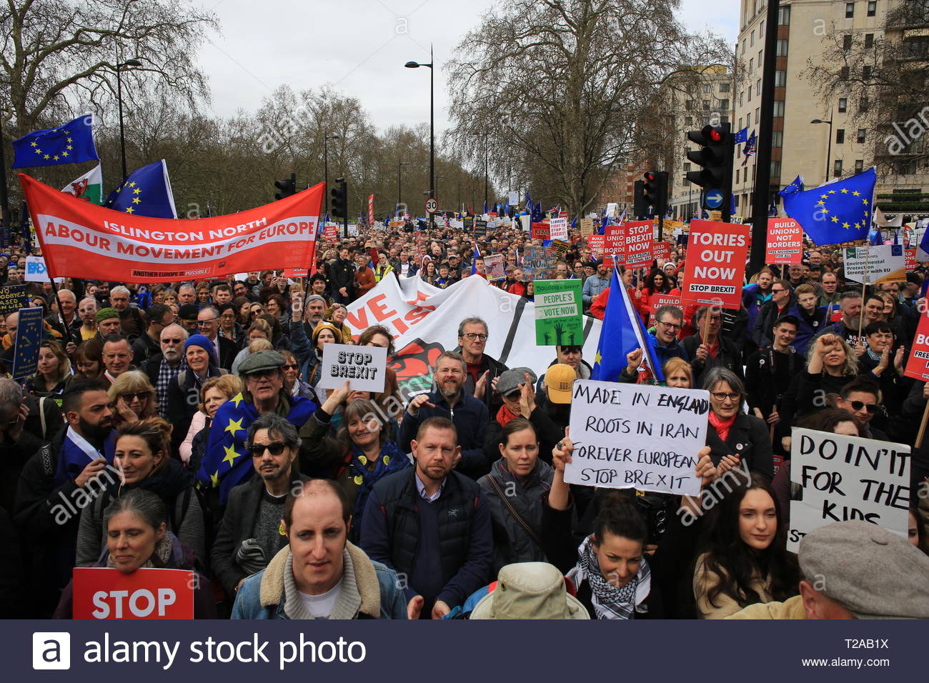 Protesters hold red union flags up in the air at a People's Vote march in London Stock Photo