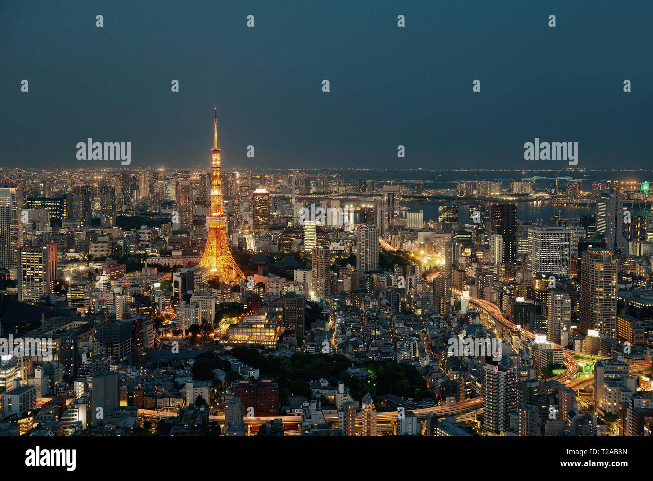 Tokyo Tower and urban skyline rooftop view at night, Japan. Stock Photo