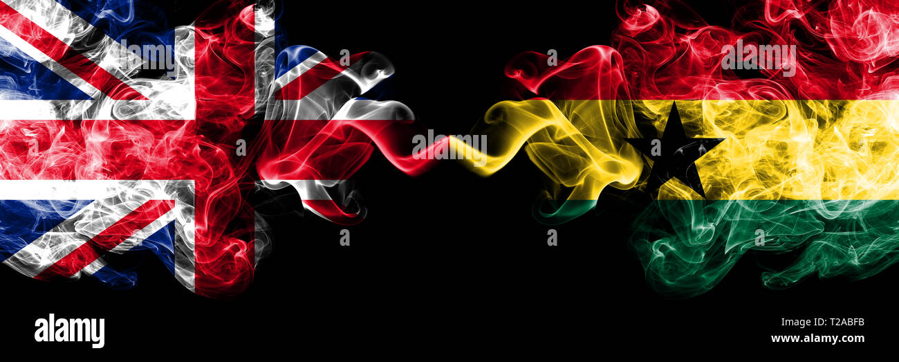 United Kingdom vs Ghana, Ghanaian smoky mystic flags placed side by side. Thick colored silky smoke flags of Great Britain and Ghana, Ghanaian. Stock Photo