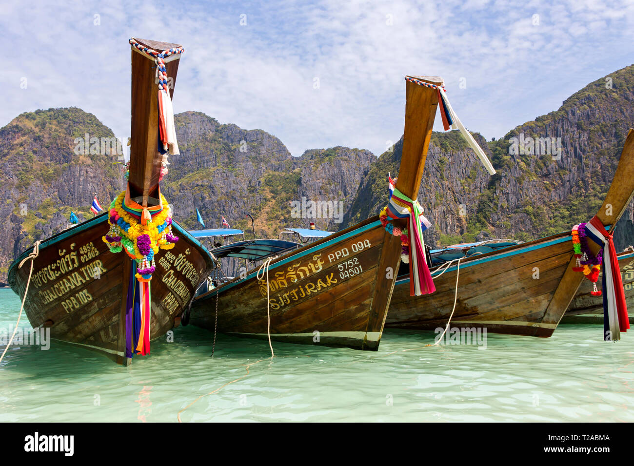 MAYA BAY - Traditional Thai Boats used to transport tourists at Ko Phi Phi Lee. The location was used in the movie the Beach. Stock Photo