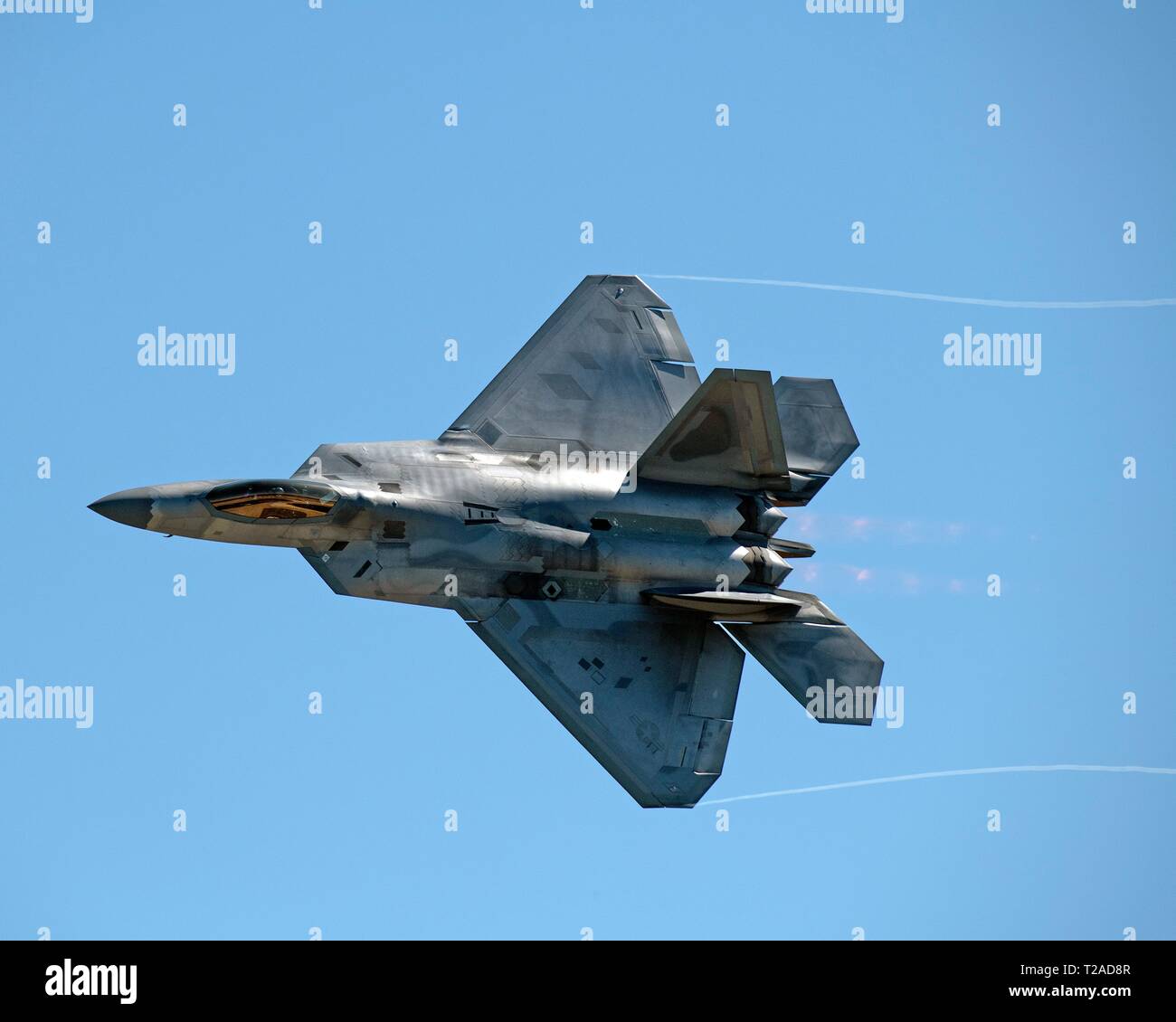A U.S. Air Force F-22 Raptor stealth fighter aircraft performs aerial maneuvers during the Thunder Over the Bay air show at Travis Air Force Base March 30, 2019 in Fairfield, California. Stock Photo