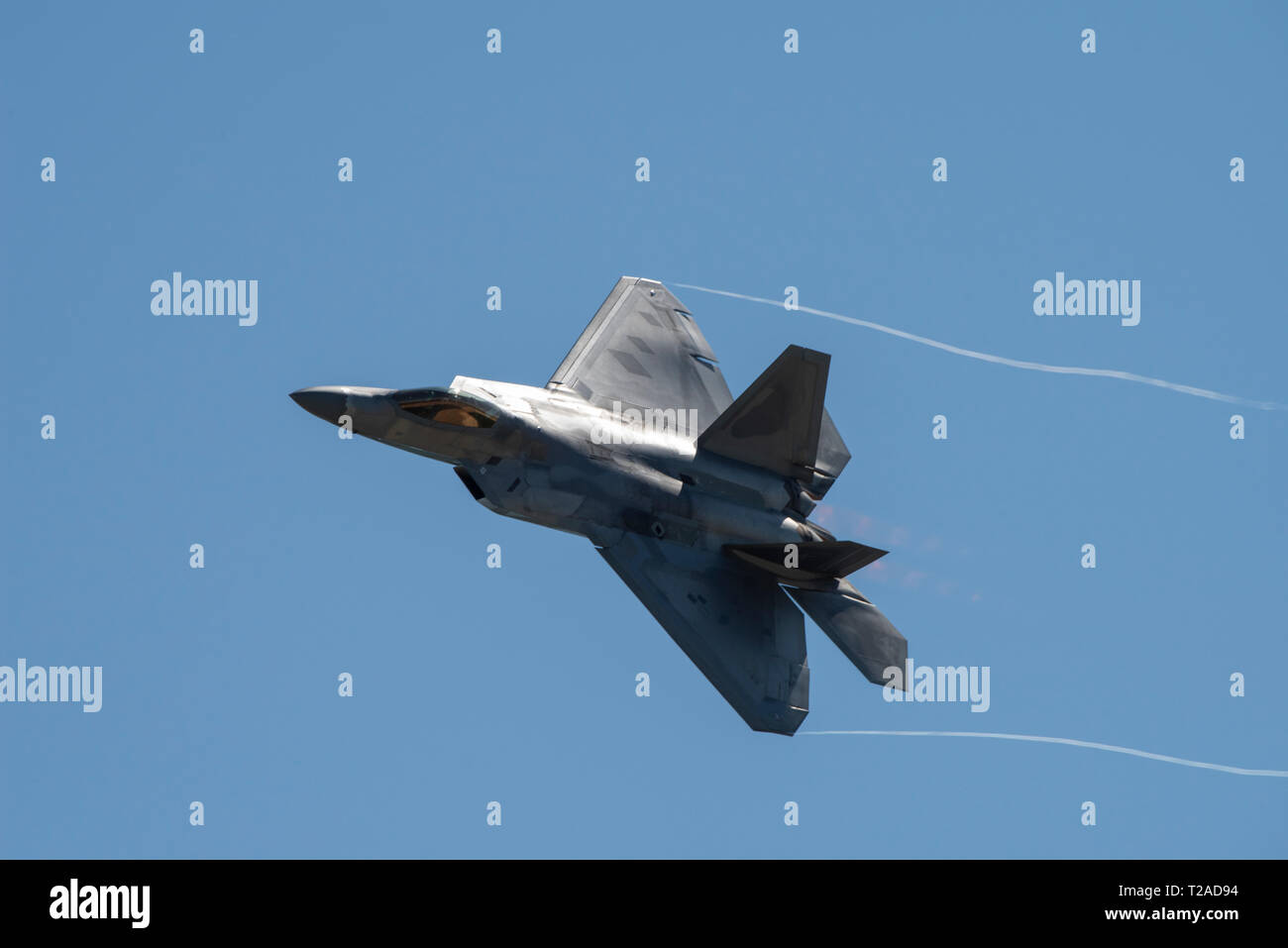 A U.S. Air Force F-22 Raptor stealth fighter aircraft performs aerial maneuvers during the Thunder Over the Bay air show at Travis Air Force Base March 30, 2019 in Fairfield, California. Stock Photo