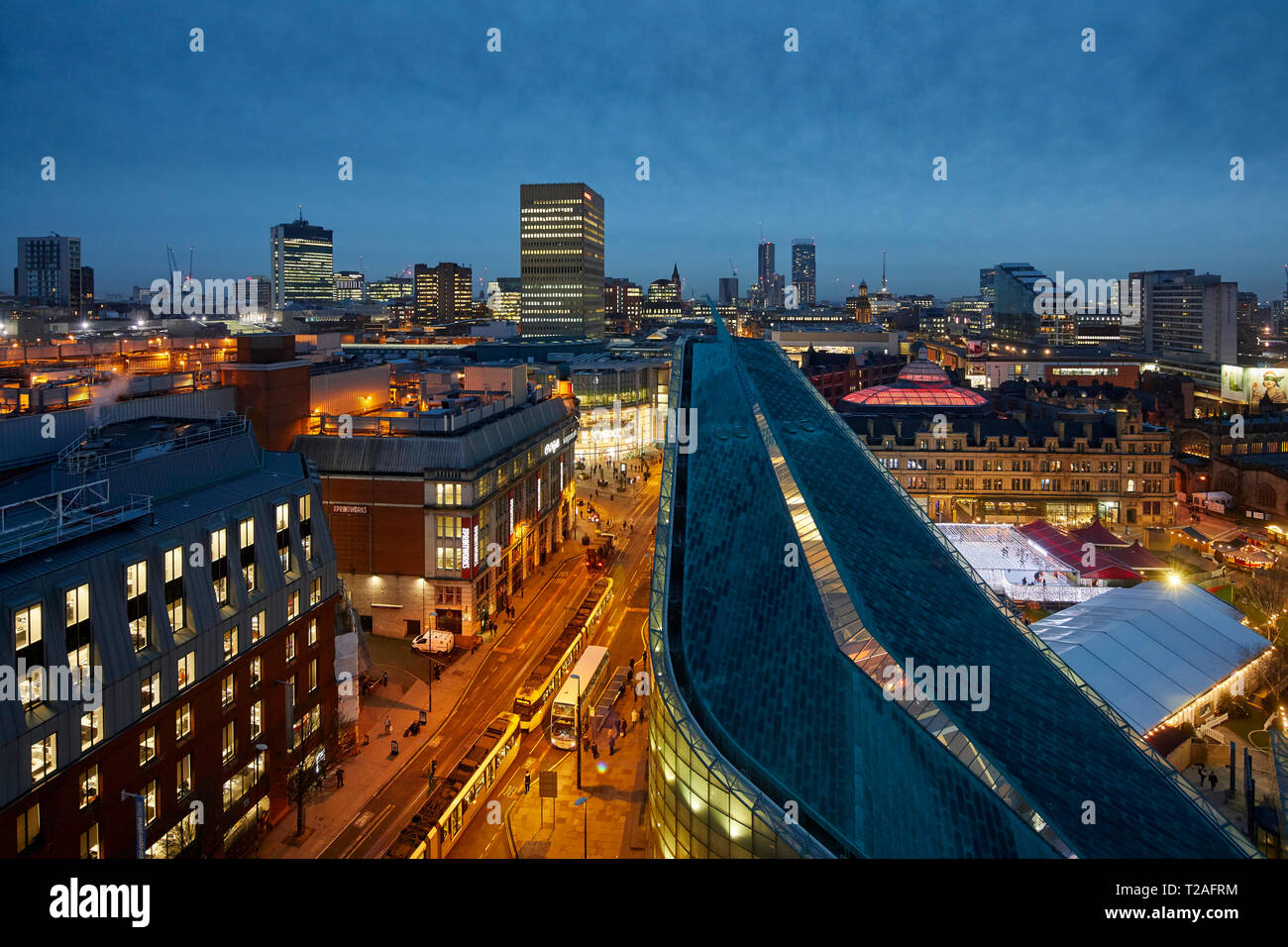 Manchester city centre skyline view across the rooftops from Hotel Indigo showing Urbis, Corn Exchange, Arndale House, along Corporation Street Stock Photo