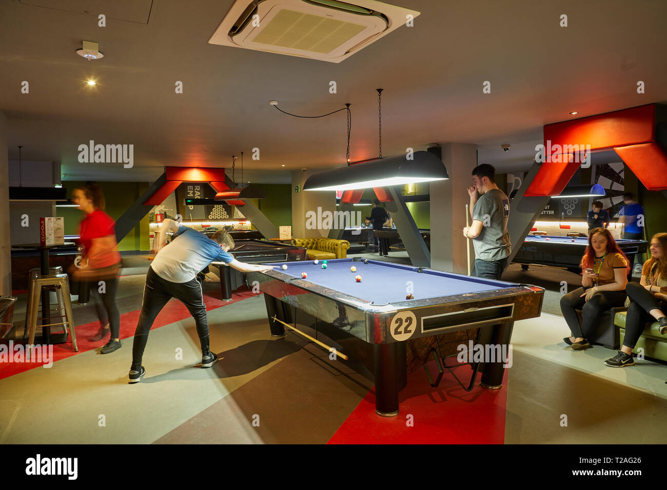Pool table at RILEYS LIVERPOOL refurbished snooker hall hosting large screen live football Stock Photo