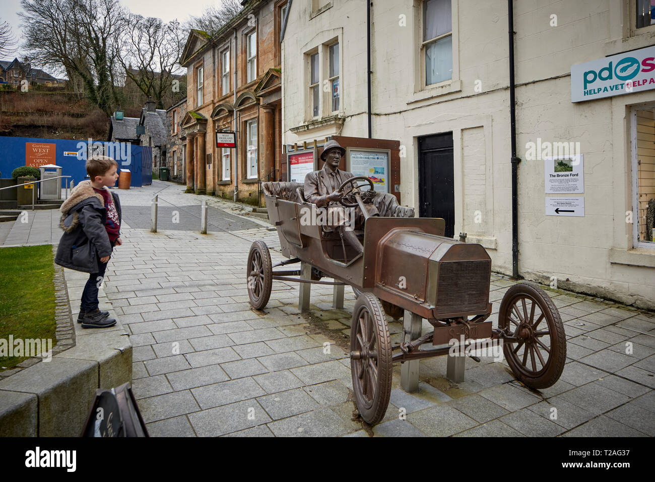 Fort William Town High Street bronze statue commemorating the model T Ford car driven up Ben Nevis a daring publicity stunt by Henry Alexander Stock Photo