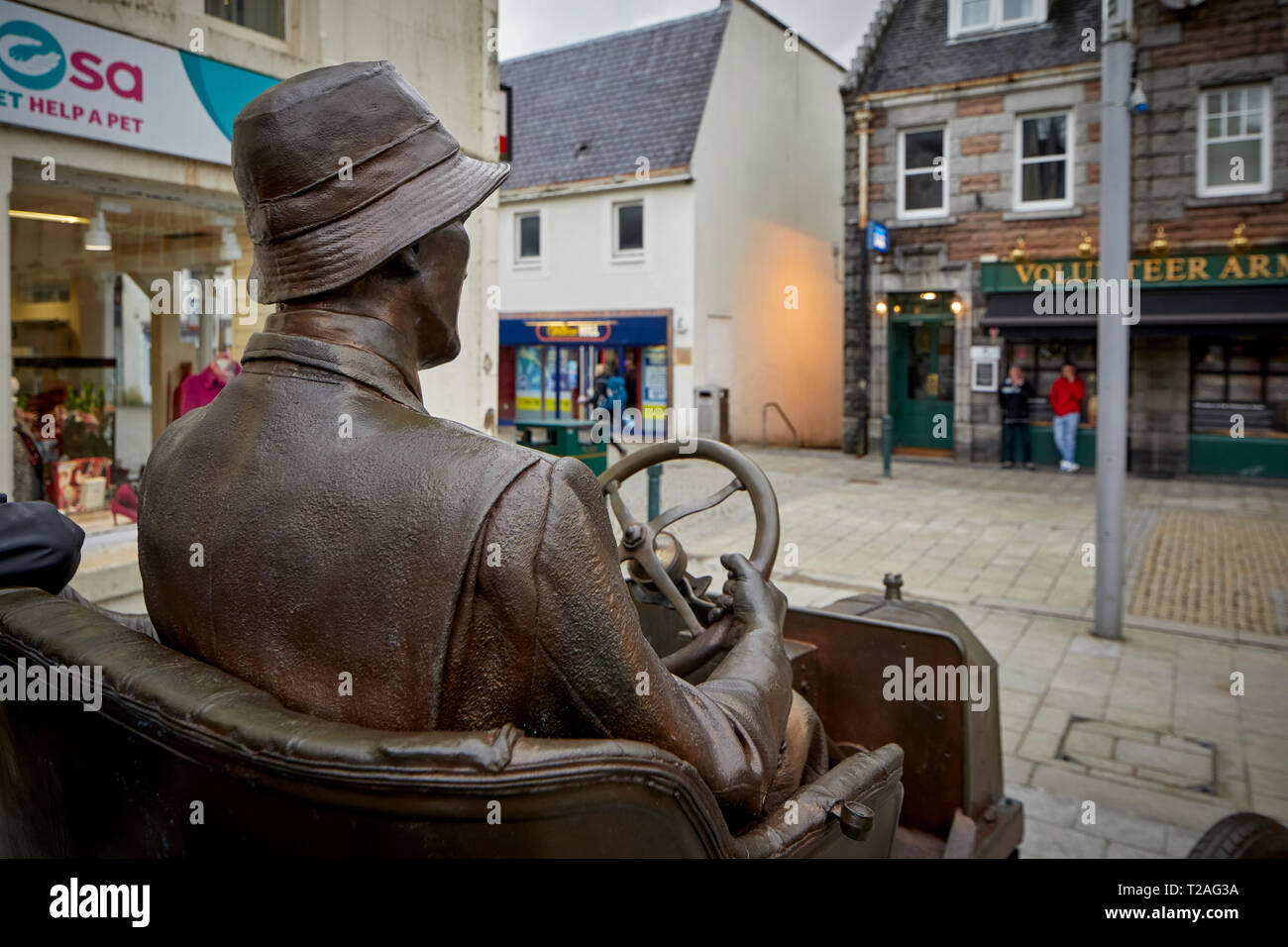 Fort William Town High Street bronze statue commemorating the model T Ford car driven up Ben Nevis a daring publicity stunt by Henry Alexander Stock Photo