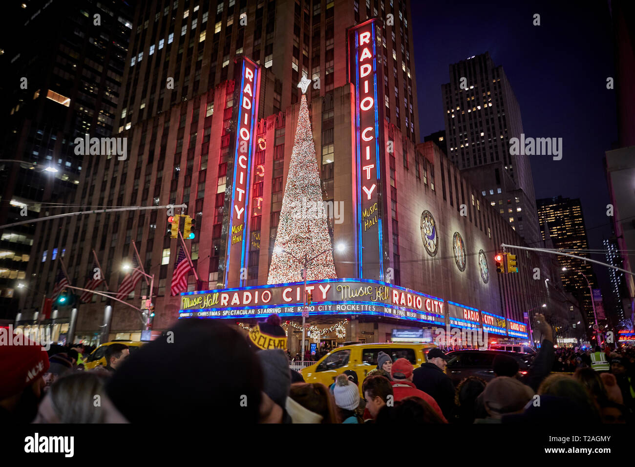 Large oversized giant baubles Christmas Decorations, 6th Avenue, Manhattan, New York at night Stock Photo