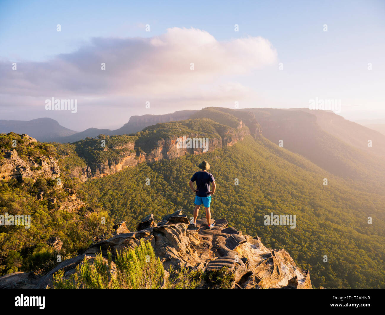 Man standing on peak of Blue Mountains in New South Wales, Australia Stock Photo