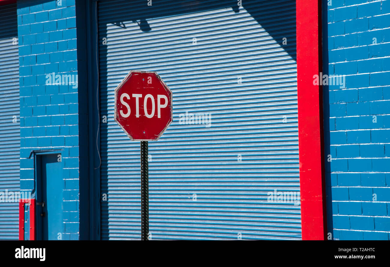 Stop Sign By Blue Garage Door Stock Photo 242407996 Alamy