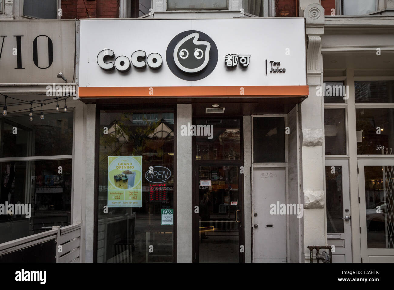 TORONTO, CANADA NOVEMBER 13, 2018 Coco Tea and Juice logo in front