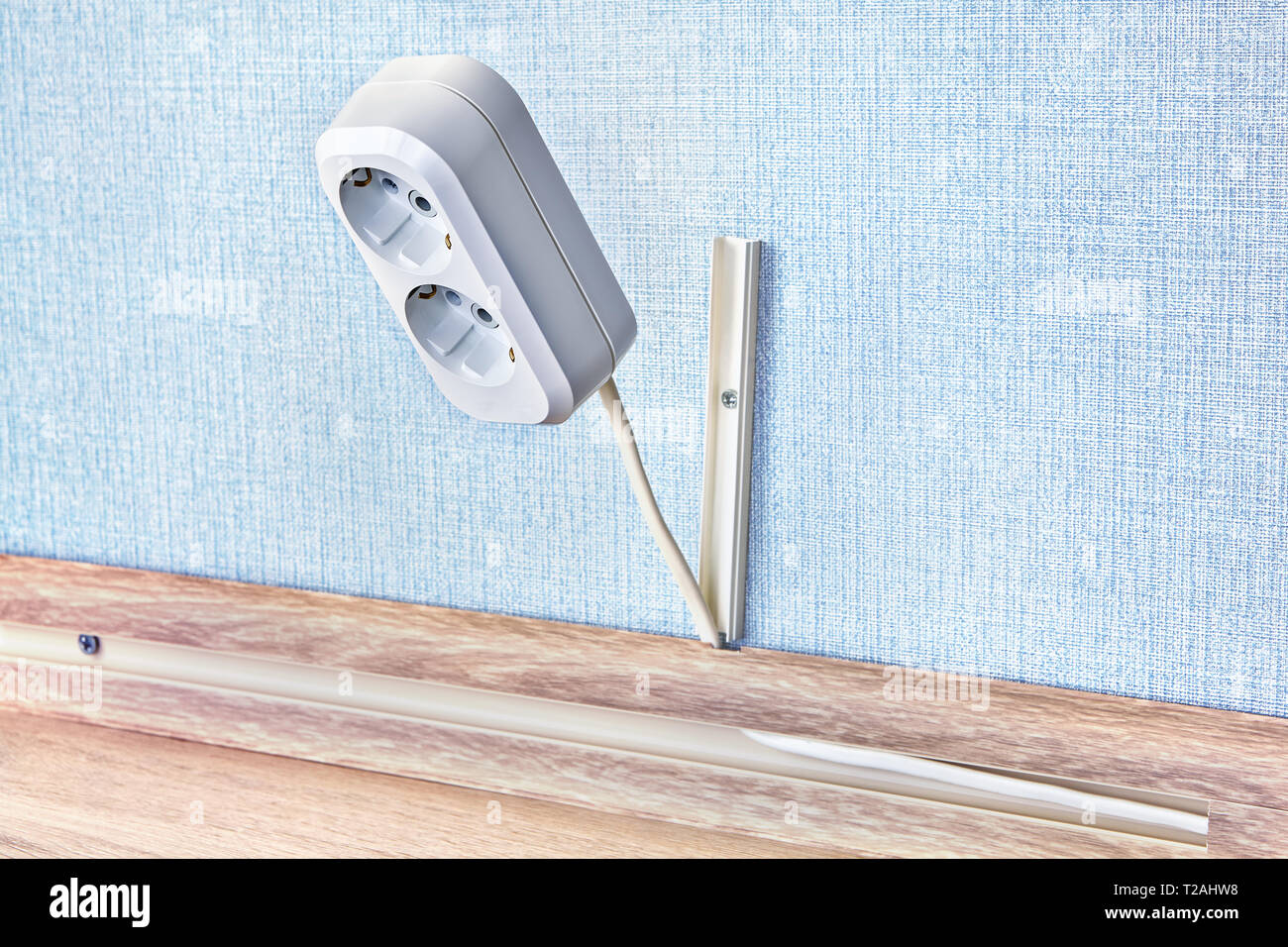 Electrical duplex power plug receptacle in white plastic box Stock