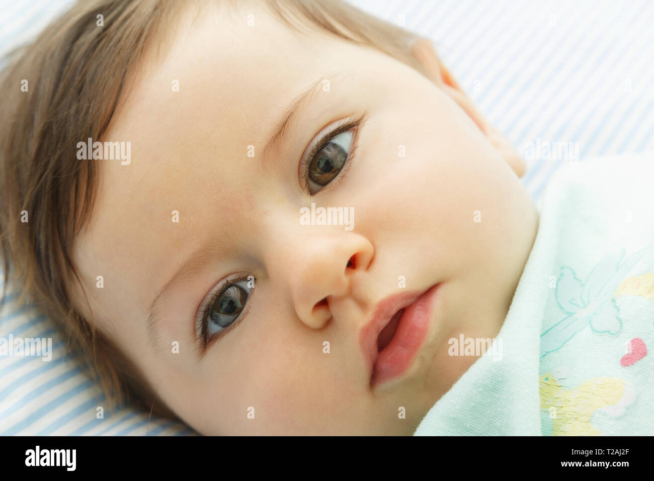 Close up of boy lying down Stock Photo