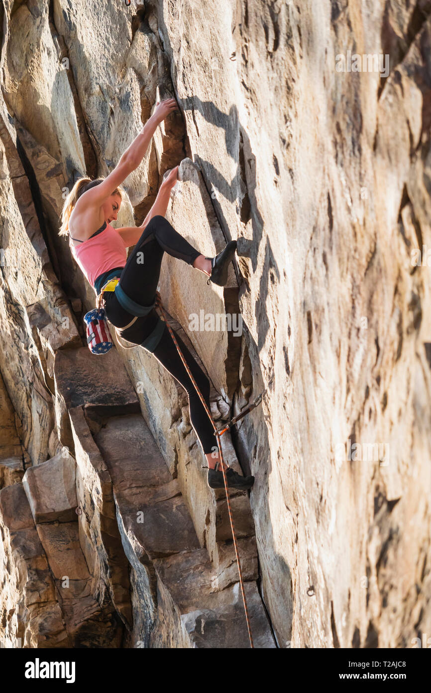 Teenage girl rock climbing Stock Photo Alamy