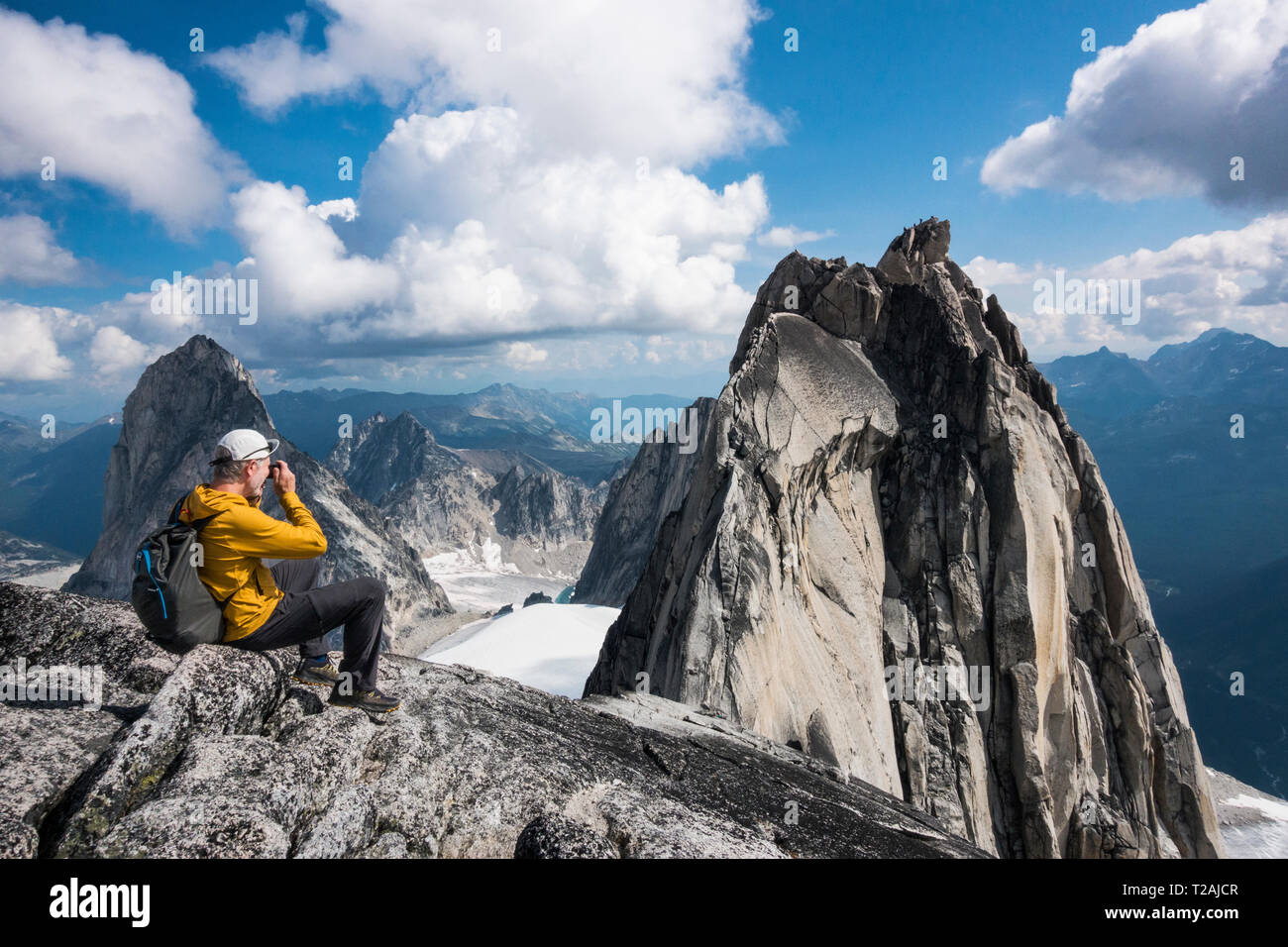 Man photographing mountain in Bugaboo Provincial Park, British Columbia, Canada Stock Photo