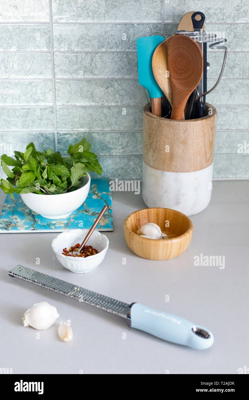 Grater with garlic on kitchen counter Stock Photo Alamy