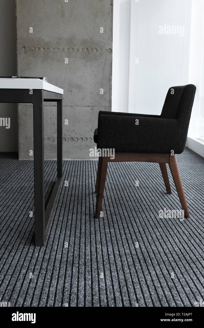 Black chair by desk Stock Photo - Alamy