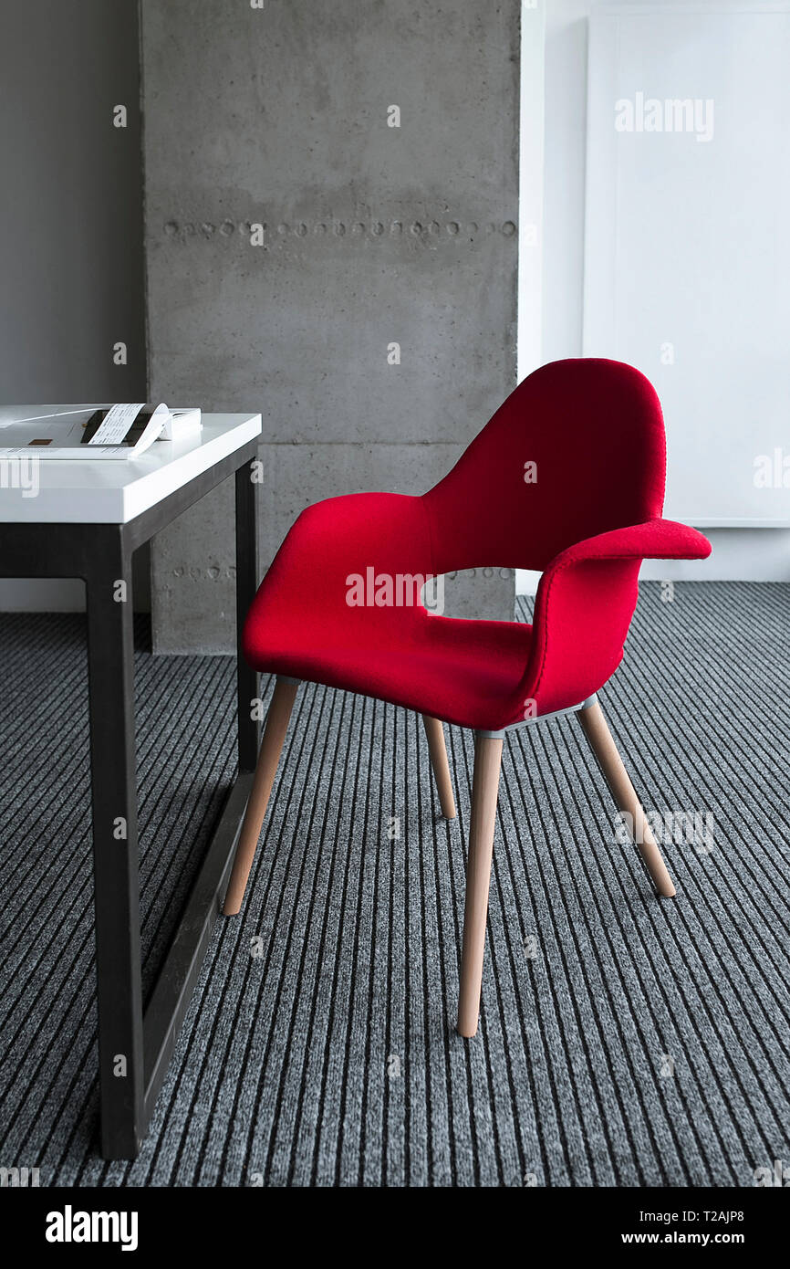 Red chair by desk Stock Photo