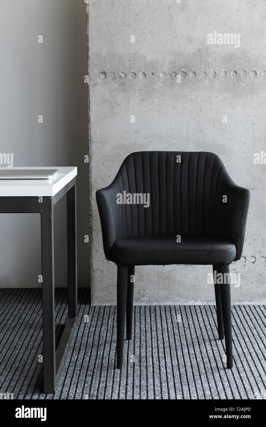 Black chair by desk Stock Photo - Alamy