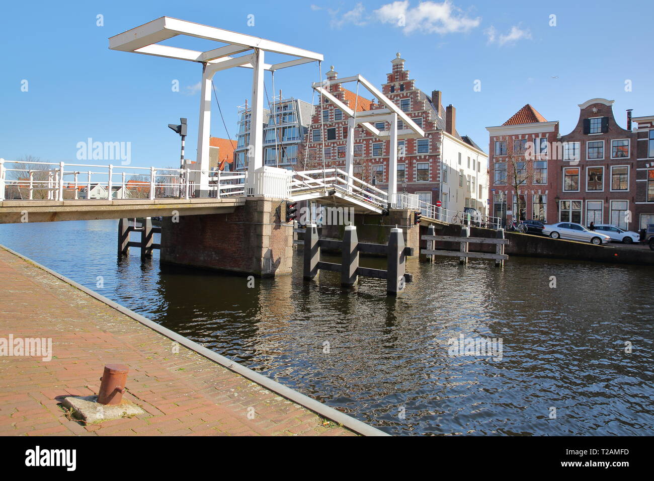 Gravestenenbrug bridge over Spaarne river and with traditional houses in the background, Haarlem, Netherlands Stock Photo