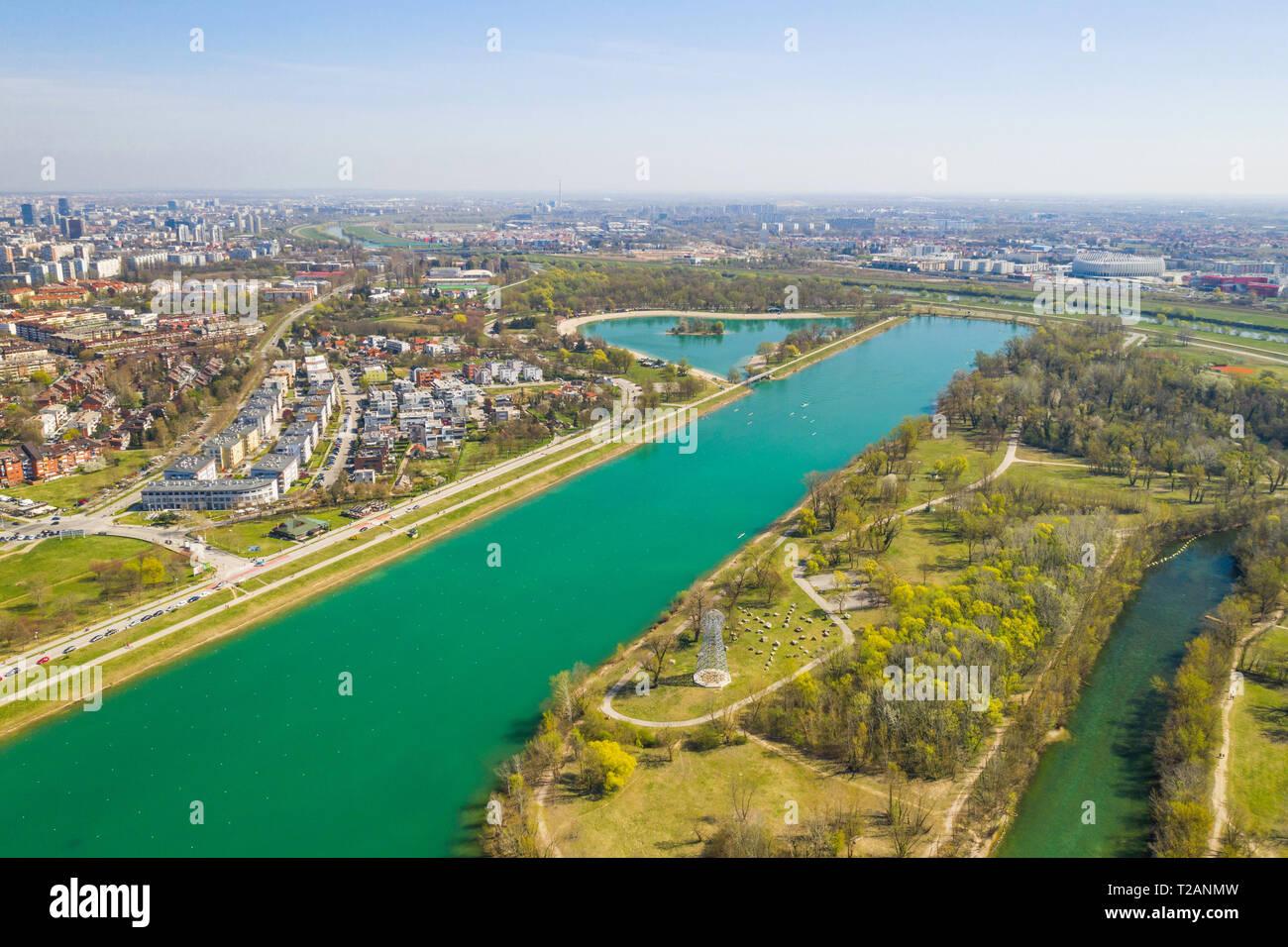 Zagreb, Croatia, Jarun lake, beautiful green recreation park area, sunny spring day, panoramic view from drone, city in background Stock Photo