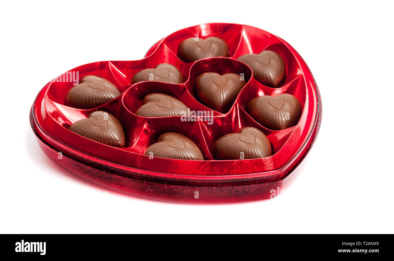 Heart shaped box of Valentine's chocolate candy isolated on white Stock Photo