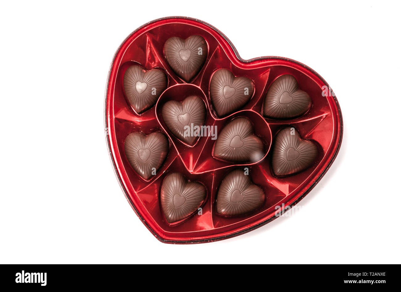 Heart shaped box of Valentine's chocolate candy isolated on white Stock Photo