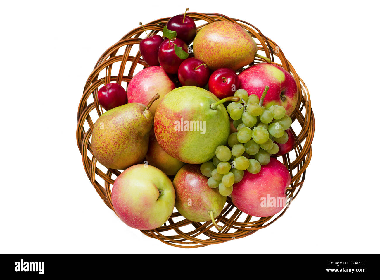 Fruit in wooden basket. Isolated on white background. Top view. Non GMO, or GMO free fresh produce. Autumn harvest concept. Stock Photo