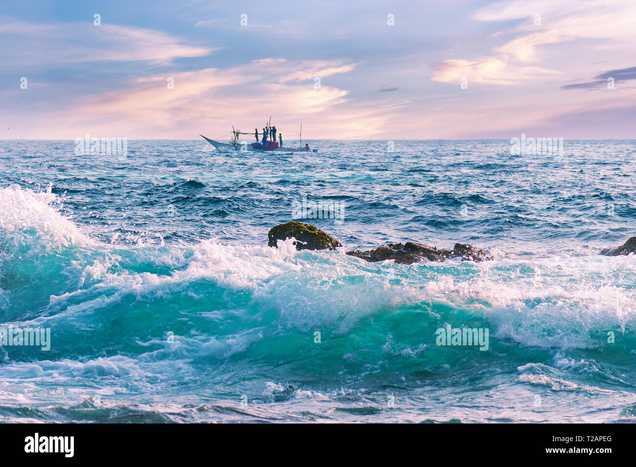 Beautiful Seascape At Sunset A Wave With Clear Water A Boat With Fishermen On The Horizon Sea With Sundown Waves And Sunset Tropical Background Stock Photo Alamy Beautiful Seascape At Sunset A Wave With Clear Water A Boat With Fishermen On The Horizon Sea With Sundown Waves And Sunset Tropical Background Stock Photo Alamy