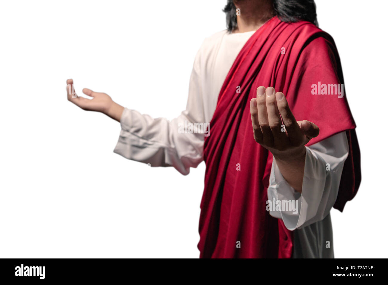 Jesus christ raised hands with open palms and praying to god posing isolated over white background Stock Photo