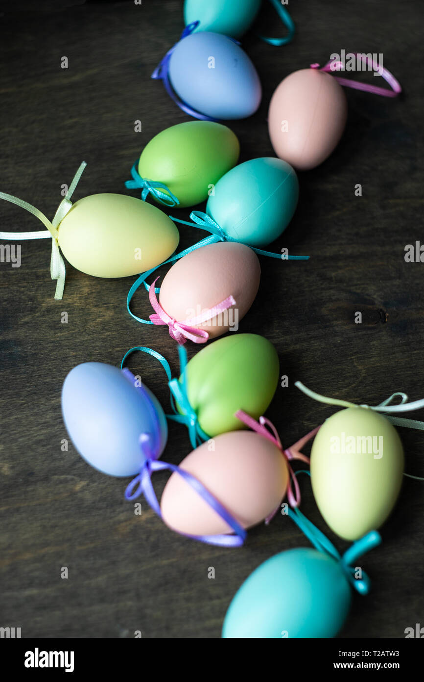 Easter holiday natural composition with first spring flowers like tricolor violas and primerose , colored eggs Stock Photo