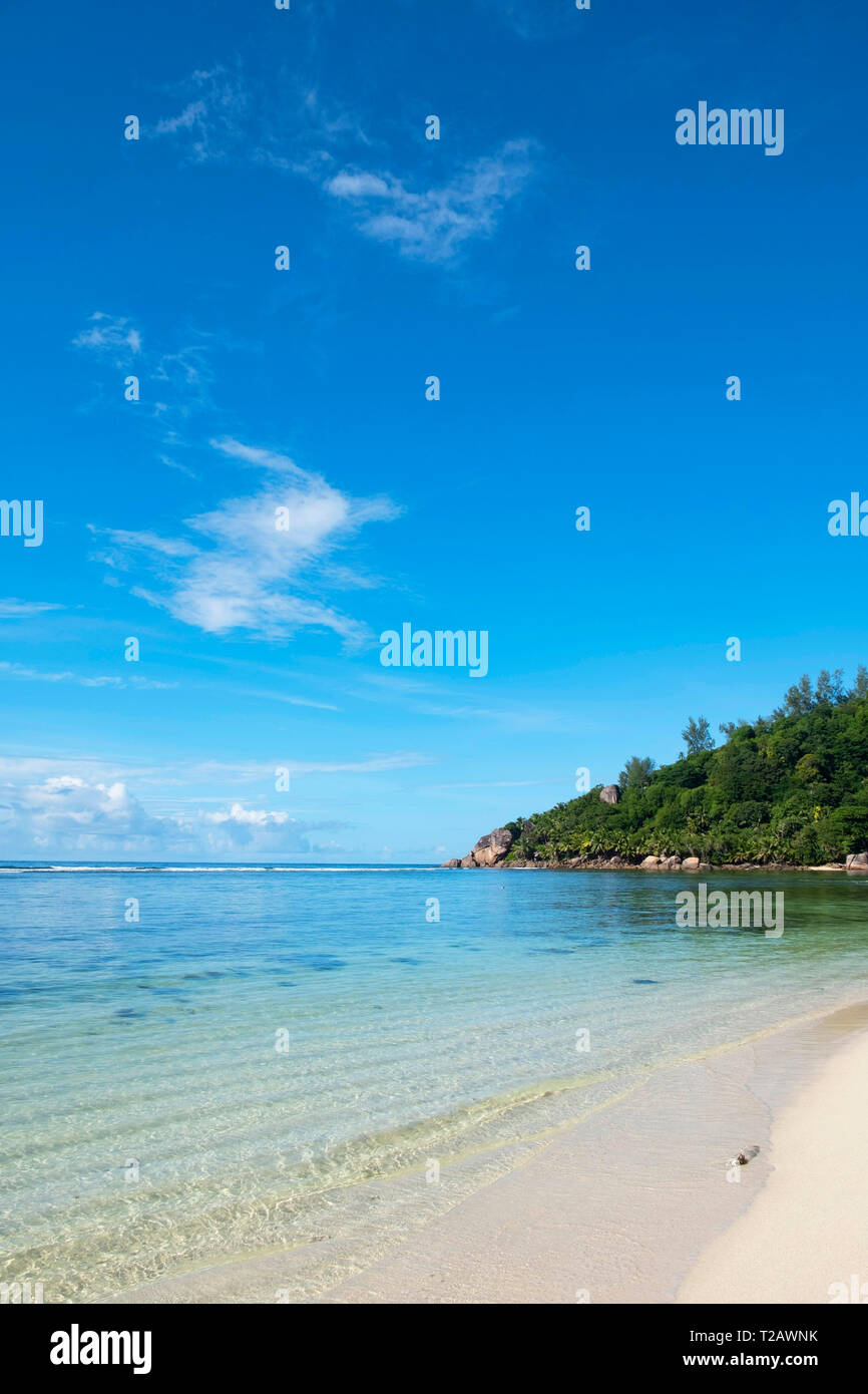 Waves lapping the sand in Bai Lazare, Mahe, the Seychelles Stock Photo