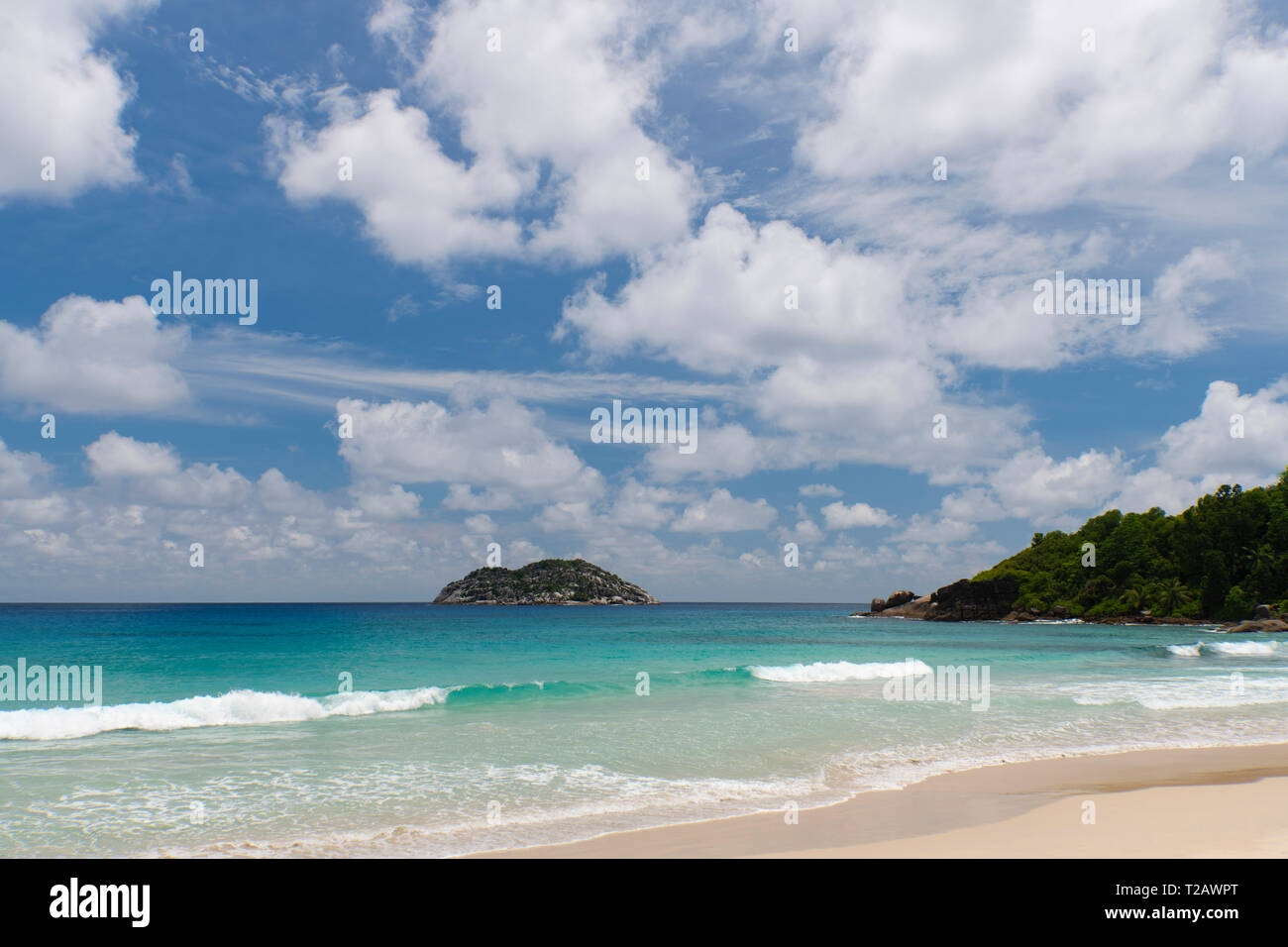 A view toward Il aux Vaches from Grand Anse on the West coast of Mahe, the Seychelles Stock Photo