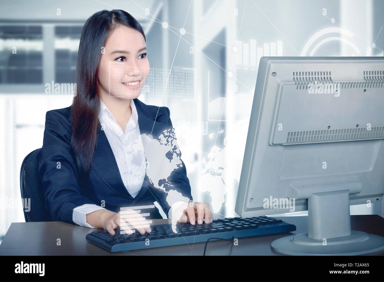 Beautiful asian business woman working with computer on the desk with virtual screen which display the interface of financial chart and world maps. Di Stock Photo