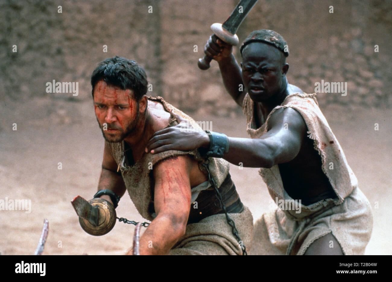 Gladiator is a 2000 epic historical drama film directed by Ridley Scott and written by David Franzoni, John Logan, and William Nicholson. The film was jointly produced and released by DreamWorks Pictures and Universal Pictures. It stars Russell Crowe, Joaquin Phoenix, Connie Nielsen, Ralf Möller, Oliver Reed, Djimon Hounsou, Derek Jacobi, John Shrapnel, and Richard Harris.    This photograph is for editorial use only and is the copyright of the film company and/or the photographer assigned by the film or production company and can only be reproduced by publications in conjunction with the prom Stock Photo