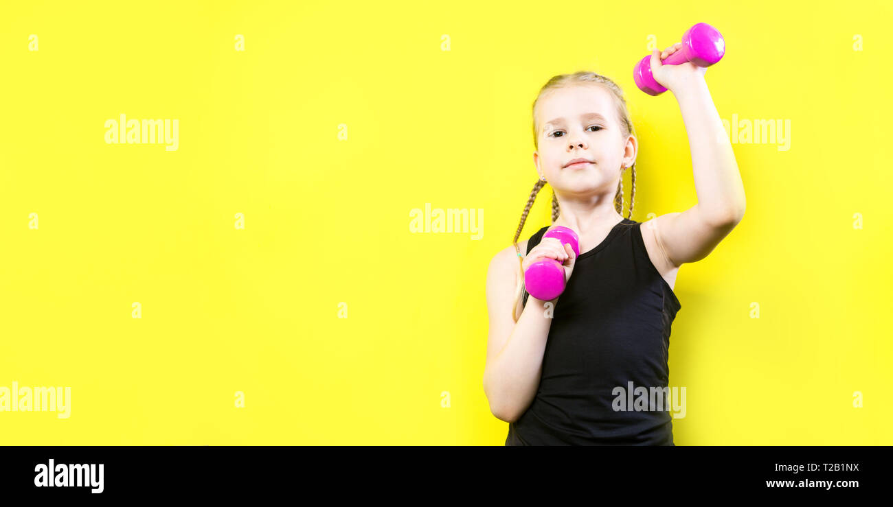 Smiling girl posing dumbbells hi-res stock photography and images - Page 2  - Alamy