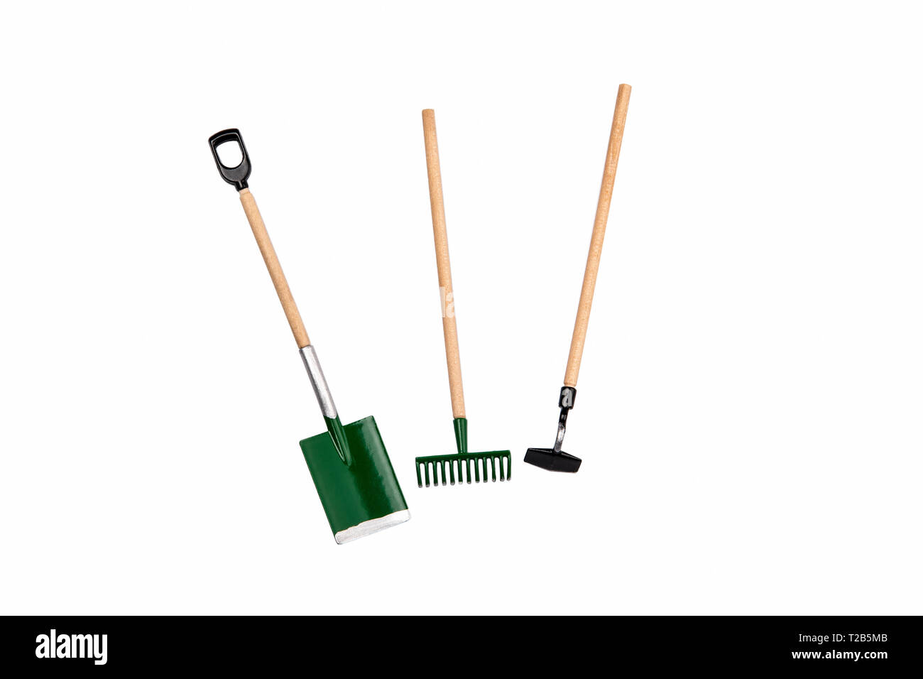 Small gardening rake, hoe and shovel isolated on white background Stock