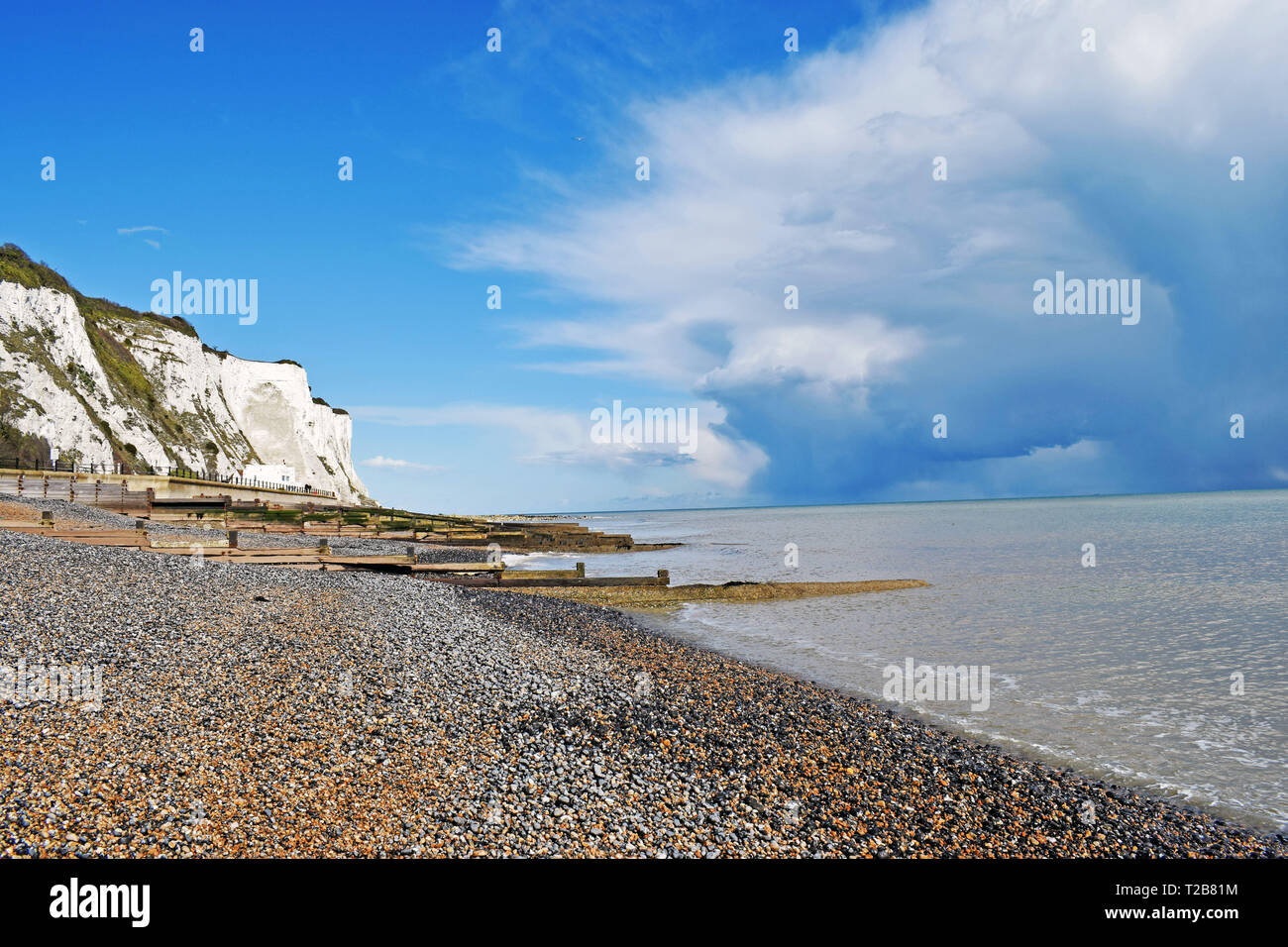 English coastline with white chalk cliff and pebble beach Stock Photo