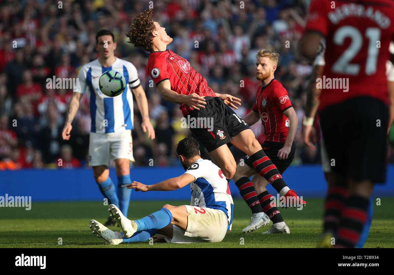 Southampton's Sam Gallagher is tackled by Brighton's Martin Montoya during the English Premier League match between Brighton Hove Albion and Southampton at the Amex Stadium in Brighton. 30 March  2019 Photo James Boardman / Telephoto Images EDITORIAL USE ONLY. No use with unauthorized audio, video, data, fixture lists, club/league logos or 'live' services. Online in-match use limited to 120 images, no video emulation. No use in betting, games or single club/league/player publications. Stock Photo
