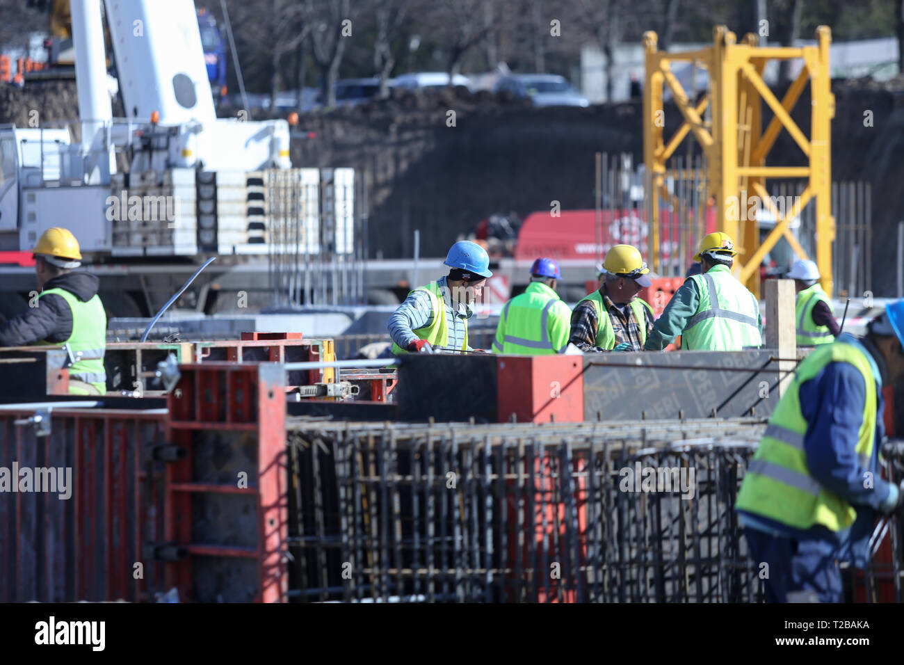 Bucharest, Romania - March 19, 2019: Workers on a construction site Stock Photo