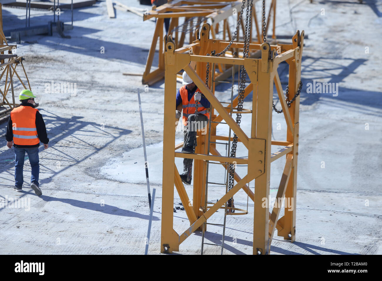 Bucharest, Romania - March 19, 2019: Workers on a construction site Stock Photo